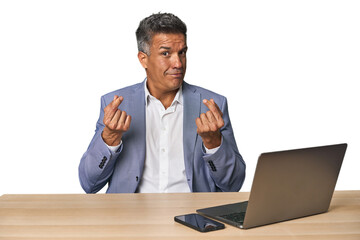 Elegant businessman at desk with laptop showing that she has no money.