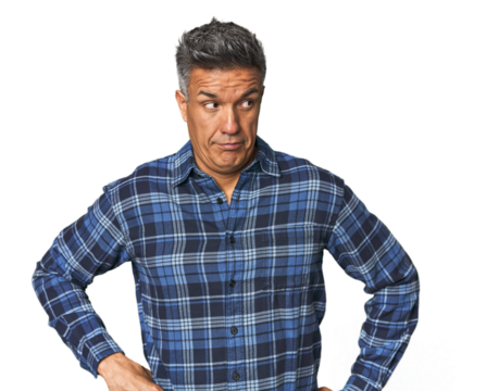 Middle-aged Latino man confused, feels doubtful and unsure.