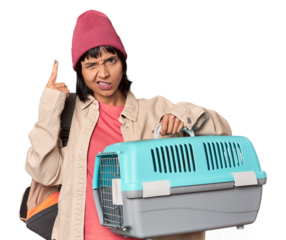 Young Hispanic woman ready for travel with pet carrier shouting and holding palm near opened mouth.