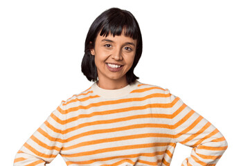 Young Hispanic woman with short black hair in studio confident keeping hands on hips.