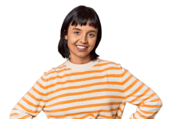 Young Hispanic woman with short black hair in studio confident keeping hands on hips.