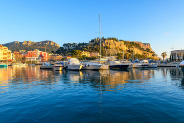 The Château de Cassis, the hilltop fortified castle, rises above the small marina at the old town...