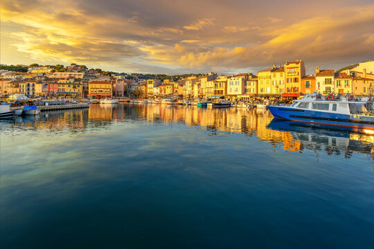A dramatic sky at golden hour sunset above the seaside fishing village and resort town of Cassis, France, in the Provence Cote d'Azur region of Southern France.