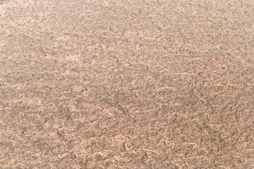 Sand texture surface. Close up top view of sand on shore salt lake, minimal nature aesthetics backdrops. Sandy abstract macro background. Selective focus, Above view, nature pattern