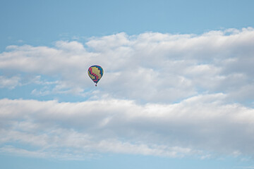 colorful hot air balloon in cloudy sky