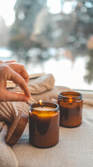 Burning candle in a cozy home interior