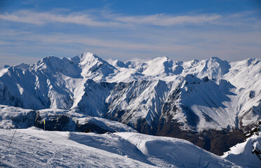 Fototapeta na wymiar Picturesque view snowy mountain peaks. The Alps at the Meribel ski area in France.