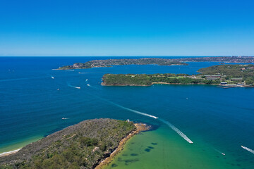 Naklejka na ściany i meble High angle aerial drone view of Grotto Point and Middle Head in the suburb of Mosman, Sydney, New South Wales, Australia. South Sydney in the background.
