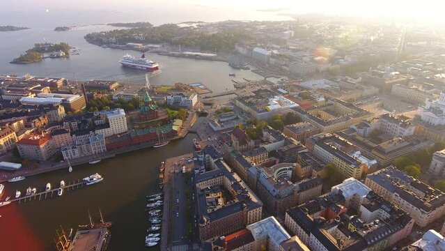  Aerial drone view to the city center, Market Square and Helsinki Cathedral. Ferry is departing from a town