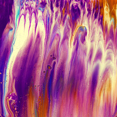 Vibrant, colorful and fluid abstract paint texture background in a modern and contemporary style with shades of purple, pink, yellow, orange, magenta