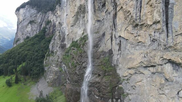 Drone shot flying up the Staubbach Waterfall in Lauterbrunnen, Switzerland