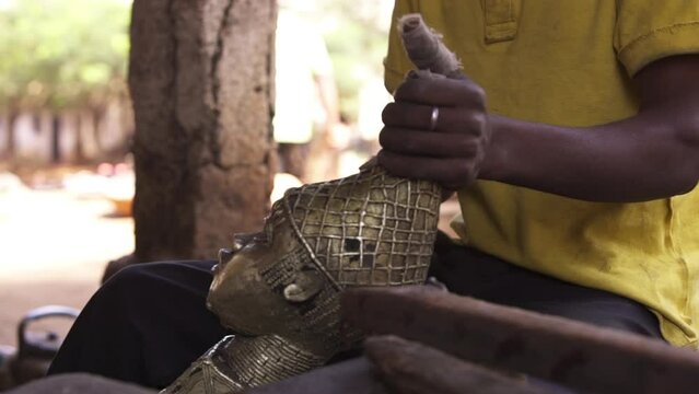 Filling a metal sculpture. Close up