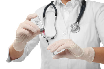 Doctor filling syringe with medication from glass vial on white background, closeup