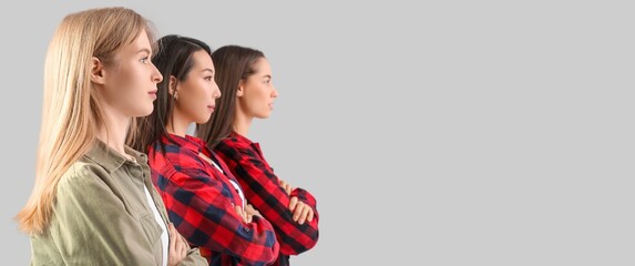 Group of beautiful young women on light background with space for text. Banner for Women History...