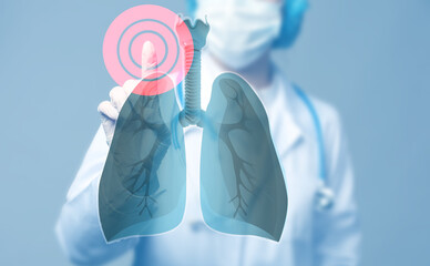 Doctor using virtual screen with picture of lungs on light blue background