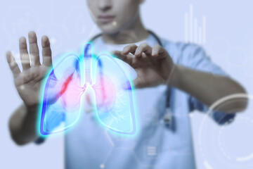 Male doctor using virtual screen with picture of lungs