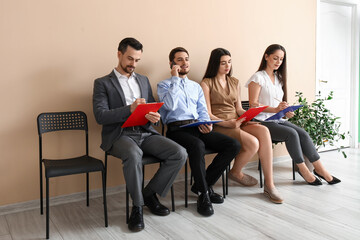 Young people waiting for job interview in room