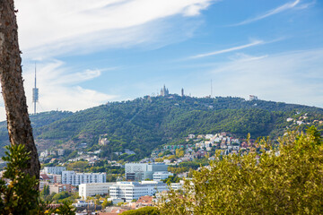 The Tibidabo hill mountain top taken from Park Guell in Barcelona. Clear blue sky.