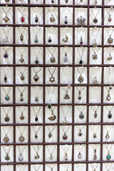 Detail shot of a store in Midyat, Mardin, where silver-made rings, necklaces and Assyrian evil eye beads are sold.