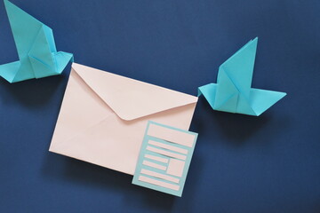 Two birds paper origami carrying letter envelope. Receiving email or mail such as newsletter...
