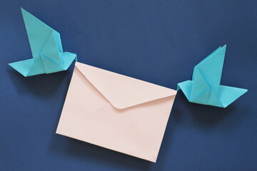 Two birds paper origami carrying letter envelope. Receiving and sending email and message, courier,...
