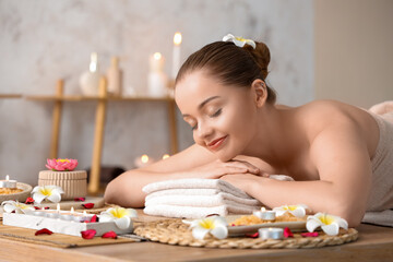 Obraz na płótnie Canvas Beautiful young woman relaxing in spa salon, closeup