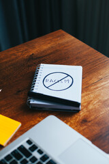 photograph of notebook with symbol of prohibition to racism on a table. 