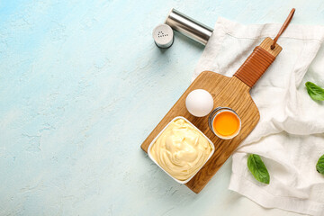 Obraz na płótnie Canvas Bowl of fresh mayonnaise and ingredients on white background