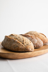Fototapeta na wymiar Loaf of bread cooked closeup on table