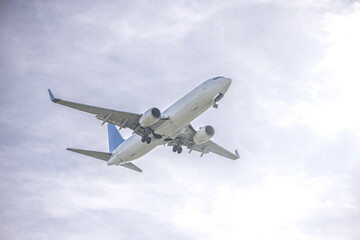 Fototapeta na wymiar A low-altitude passenger plane near the runway