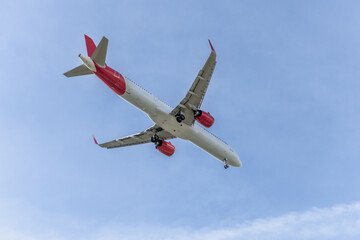 Fuselage of a passenger plane in a beautiful blue sky.