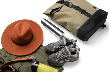 Set of traveler accessories with backpack, shoes and thermal bottle on white background