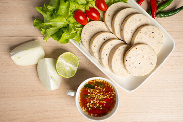 Flat-lay Sliced Vietnamese pork sausage on a white plate.Asian food.