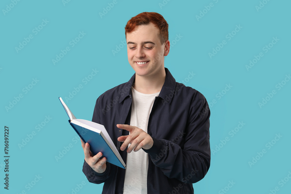 Poster smiling man reading book on color background