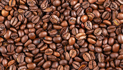 Obraz premium Top view of brown roasted coffee beans, can be use as background, copy space for text. High quality photo