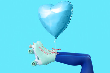 Balloon and legs of woman in roller skates on blue background