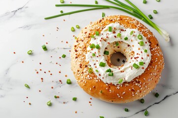 Tasty bagel with cream cheese and green onion on table top view