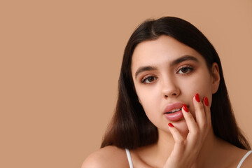Young woman with beautiful lips on color background, closeup
