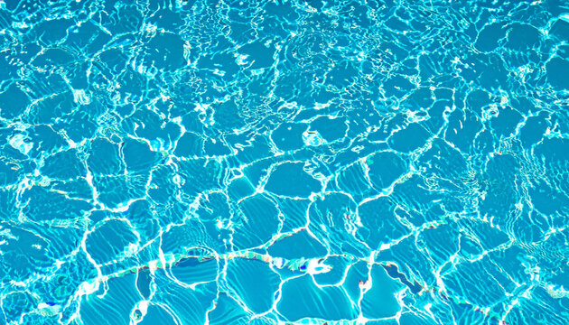 Surface of water blue swimming pool background. High quality photo