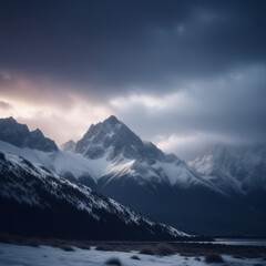 Snow covered mountains in winter, snow kissed mountains capture the mysterious essence of dawn under a cloudy rainy sky
