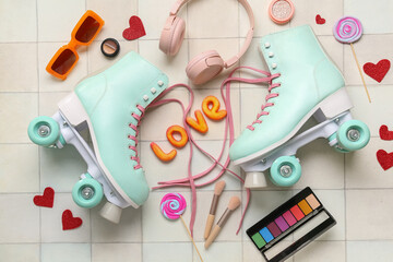Composition with pair of vintage roller skates, modern headphones and cosmetic products on light tile background
