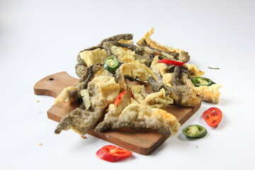 Crispy fish skin with chili sprinkled on top