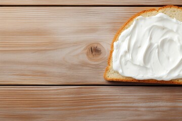 Top view of cream cheese on bread on wooden table - obrazy, fototapety, plakaty