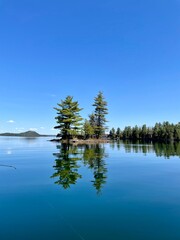 Beautiful small island, crystal clear water, in our beautiful 31 Mile Lake, Gracefield, Quebec, Canada. Photo taken while fishing on a beautiful sunny day.