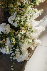 A white floral display plays with shadow and light 