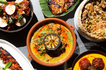 Table full of Indian dishes