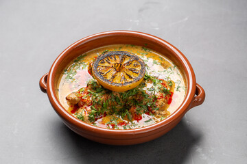 Curry topped with smoked lemon