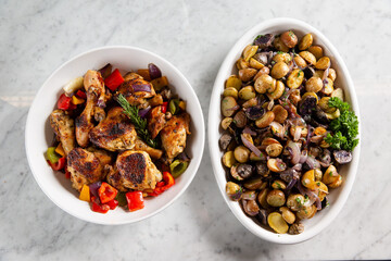 Sharing plates of chicken and olives