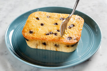 A fork taking a stab at a gluten free blueberry cake