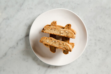 Biscottis on a white plate from above